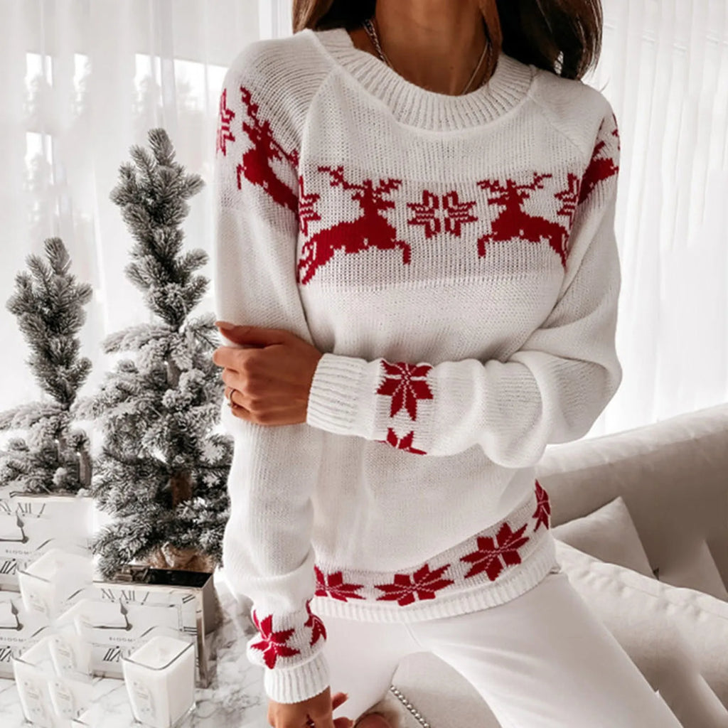 Women’s red and white Christmas jumper with snowflakes and reindeer design