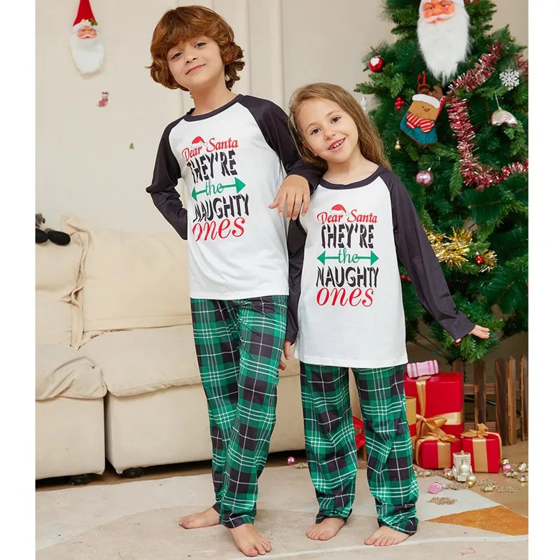 Family bonding in "naughty or nice" themed pajamas