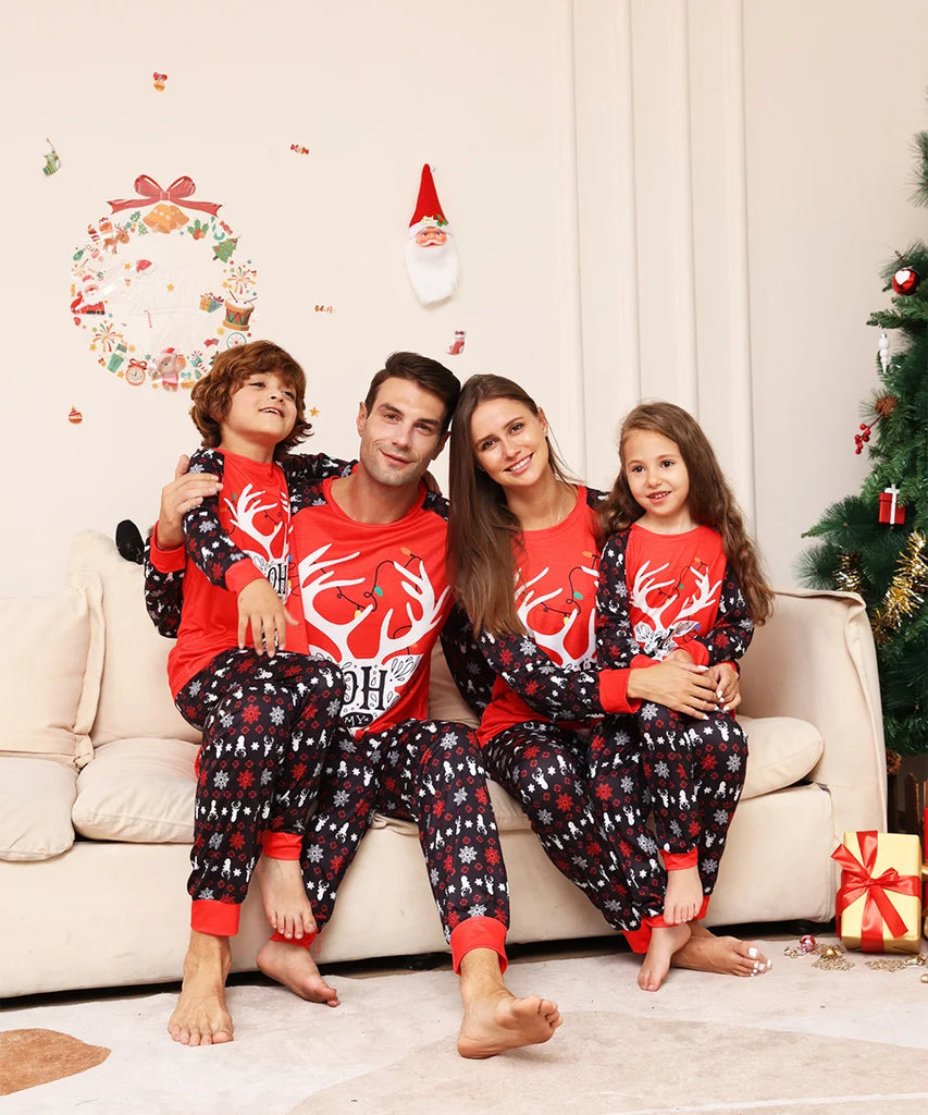 Family matching holiday pyjamas with reindeer