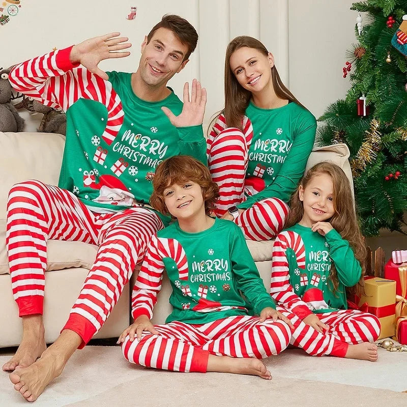 Festive family gathering in holiday candy cane PJs